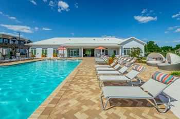 resort style pool and sundeck  at Anthem Apartments and Luxury Rental Homes in Huntsville, ALat Reserve of Foley in Foley, AL